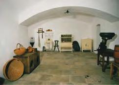 Interior of the sitting room of the farmstead from Mokrá Lhota documenting a household from the first half of the 20 th century.