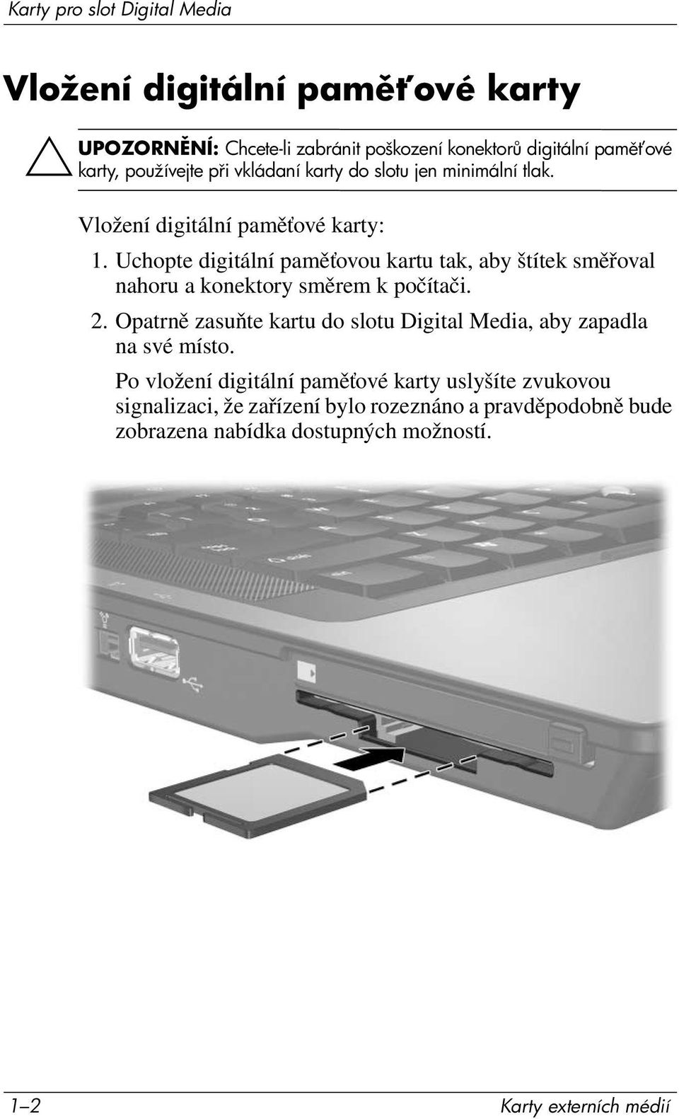 Uchopte digitální paměťovou kartu tak, aby štítek směřoval nahoru a konektory směrem k počítači. 2.