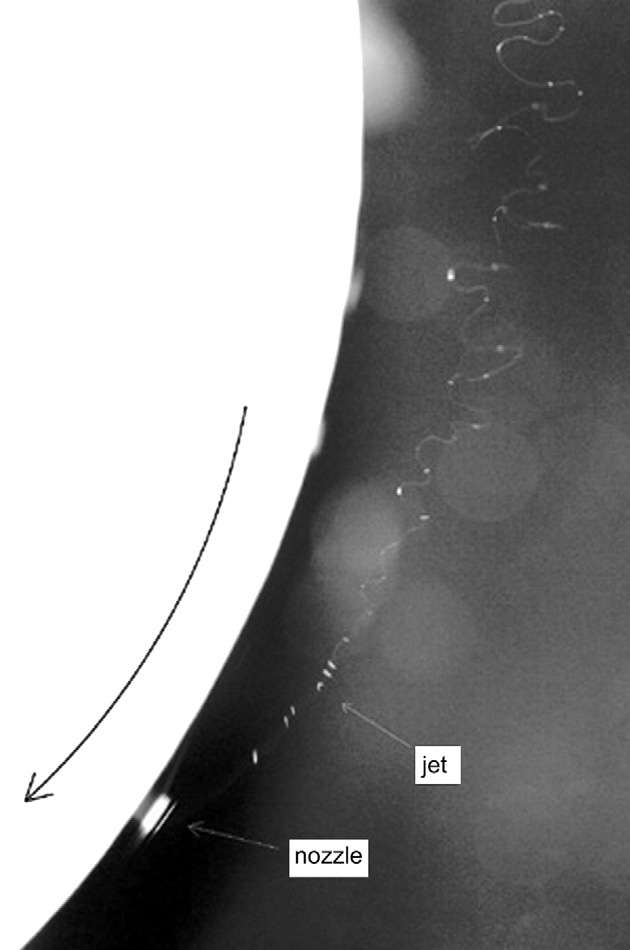 KOMBINACE ELEKTROSTATICKÉHO ZVLÁKŇOVÁNÍ A FORCESPINNIGU Image of PAN nanofiber formation in electrocentrifugal spinning at