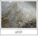 albit - z plagioklasové řady živců, hlinitokřemičitan sodnovápenatý, chem. vz. (Na,Ca)AlSi3O8, 6 tvr., 2,64 hust., 1,54-1,55 ind.l., 0,009 dvojlom, lesk skelný až perleťový, obvykle bezbarvý,
