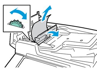 Řešení problémů 4. Chcete-li vyjmout předlohu z podavače, otočte zeleným kolečkem ve vyznačeném směru a dokument opatrně vytáhněte.