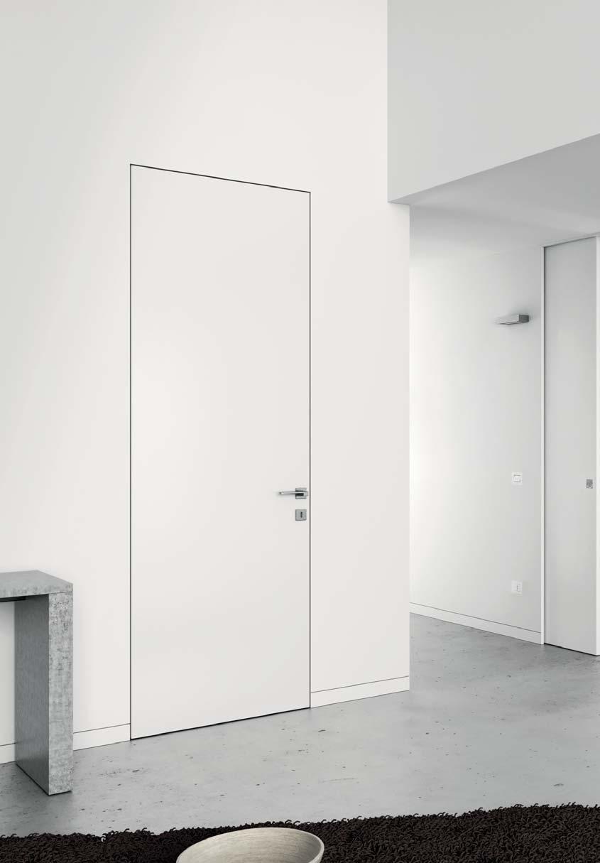 Díky naprosté integraci dveří se stěnou vytváří jedinečný dojem neviditelných dveří.