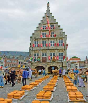 den: Zaanse Schans skanzen života ve "starém" Holandsku, větrné mlýny, sýrárna, výroba barev, řemesla.