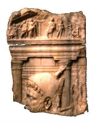 Obrázek 50 Reliéfní fragment zobrazující chrám Quirina, v popředí hlava flamena.