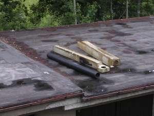 Opravené střechy Skládka za