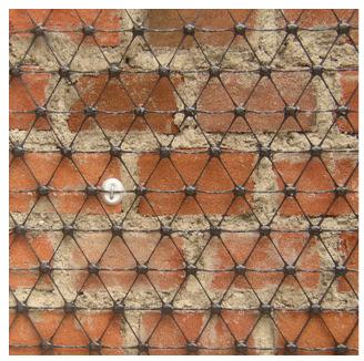 solution for the seismic performance enhancement (Figure 3.6). Figure 3.6 - Polymeric grid and its installation 3.4.