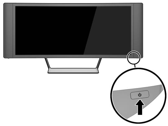 3. Zapněte monitor stisknutím tlačítka vypínače pod pravým reproduktorem.