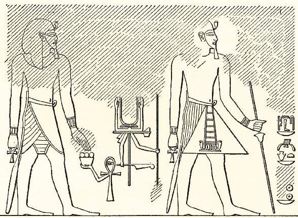 V levé ruce svírá dlouhou hůl, na níž je umístěn květ papyru.