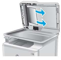 5. Otevřete víko skeneru. Pokud papír uvízl za bílým zadním plastovým krytem, jemně jej vytáhněte. 6. Zavřete víko skeneru.