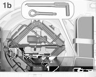 kolem v zavazadlovém prostoru. Klíč na kola a tažné oko se nacházejí v sáčku na nářadí umístěném v prohlubni pro rezervní kolo blízko sady nářadí.