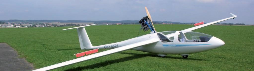 TST-14 Bonus Dvoumístný ultralehký větroň pro rekreační létání a pro výcvik, středoplošník s ocasními plochami tvaru T a s pevným přistávacím zařízením postavený převážně z uhlíkových a skelných