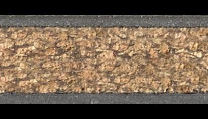 Dekorativní materiál s ochrannou vrstvou proti opotřebení