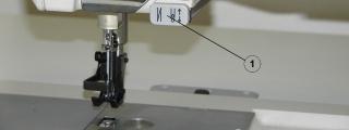 5.13 Funkce zpátkovacího tlačítka Pokud stisknete během šití zpátkovací tlačítko (1), uvedete stroj do