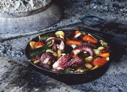 Food is placed in the shallow dish and then is covered with an iron bell and live coals.