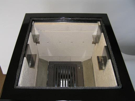 Obrázek 5 Obrázek 6 Varianta s teplovodním ohřívačem má na místo zadního a horního šamotu vložen teplovodní ohřívač obr.