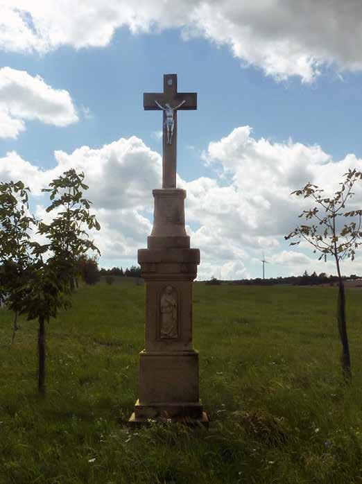 Na podstavci má vpředu špatně čitelný latinský nápis s chronogramem, vzadu je věnování: NAKLAD TEN GIRIK TRONDA ROKU 1803.