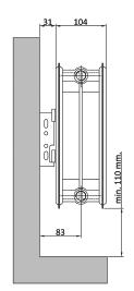 V požadované výšce radiátoru vyvrtáme otvory pro umístění konzol průměr vrtáku je 10 mm vzdálenost otvoru od horní hrany tělesa je 165 mm.