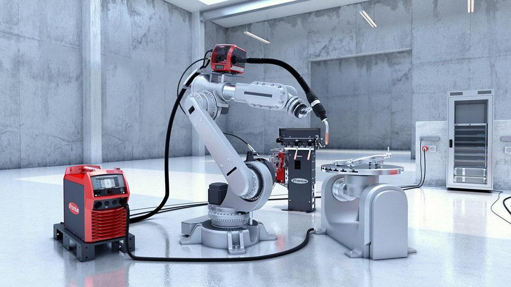 Poznámka: Obr. 14: Příklad automatického pracoviště technologie MIG/MAG od firmy Fronius [13] Bowdeny vedou dráty uvnitř hořáku viz Obr 2.