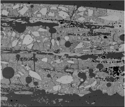 500µm Fig. 14 Zone B CONCLUSIONS A ductile refractory composite has been developed for electric insulation with optimized strain hardening characteristics and thermal shock resistance.