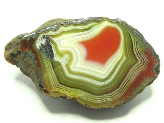 Obr. 2.64. Geoda vyplněná achátem rovinný brus; šířka snímku 80 mm. Agate Creek, Queensland, Austrálie. Foto: Mark Rheinberger. Obr. 2.65.