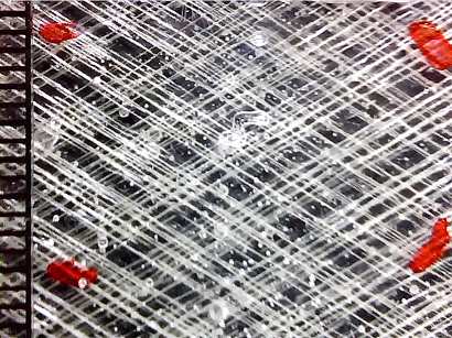 Kapitola 6: Progresivní a únavové poškozování E-glass/epoxy laminátů (a) (b) (c) (d) Obr. 48 Snímky mikro poškození laminátu [±60] S získané mikro kamerou v závislosti na osové deformaci ε x.