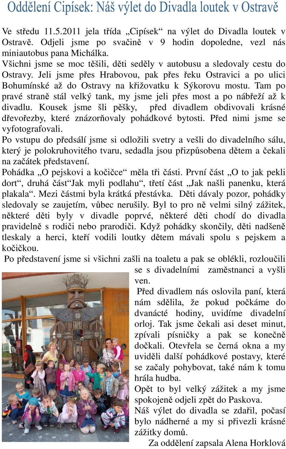 Tam po pravé straně stál velký tank, my jsme jeli přes most a po nábřeží až k divadlu. Kousek jsme šli pěšky, před divadlem obdivovali krásné dřevořezby, které znázorňovaly pohádkové bytosti.