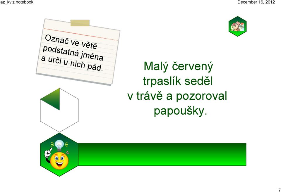 Malý červený trpaslík seděl v trávě a