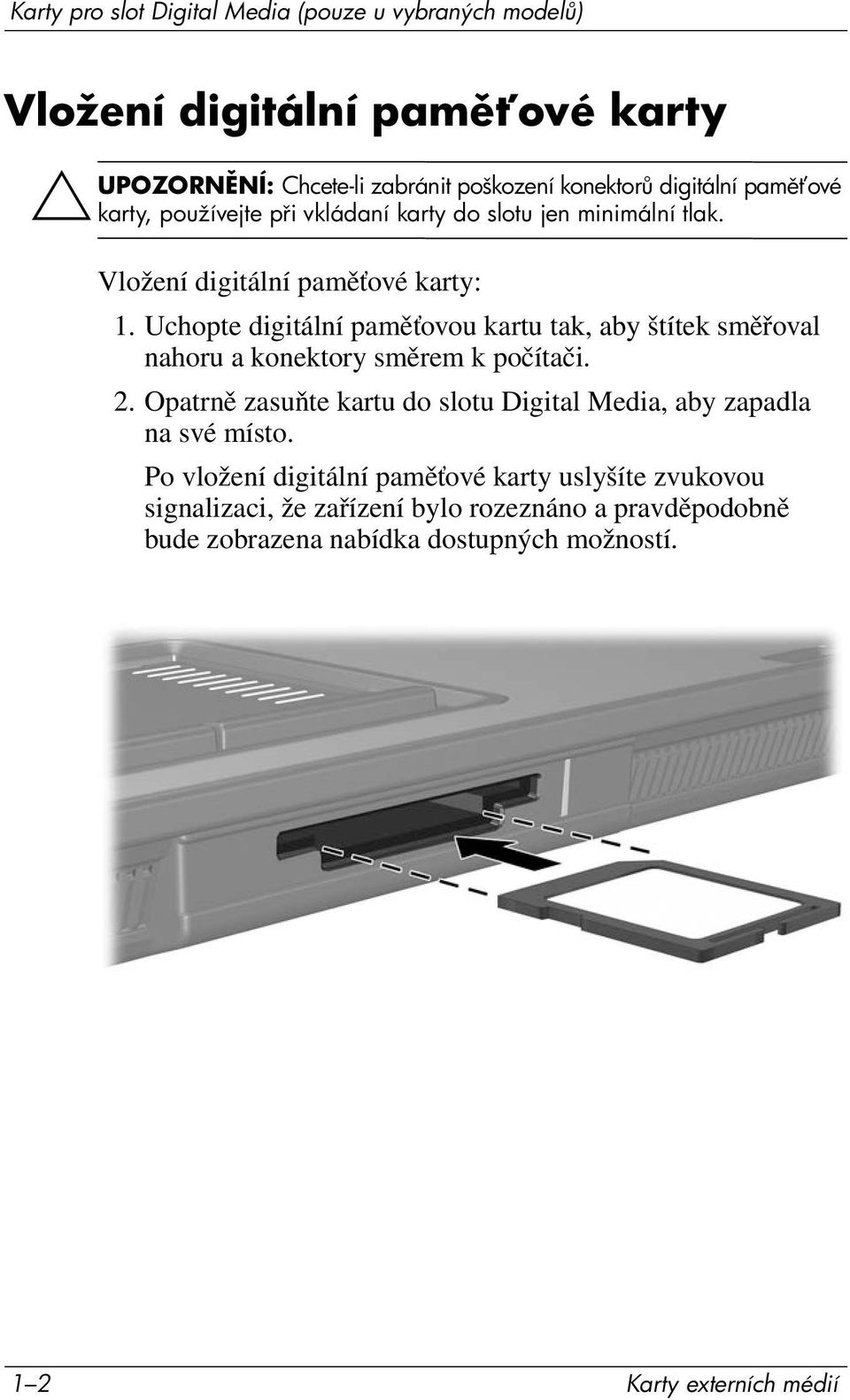 Uchopte digitální paměťovou kartu tak, aby štítek směřoval nahoru a konektory směrem k počítači. 2.