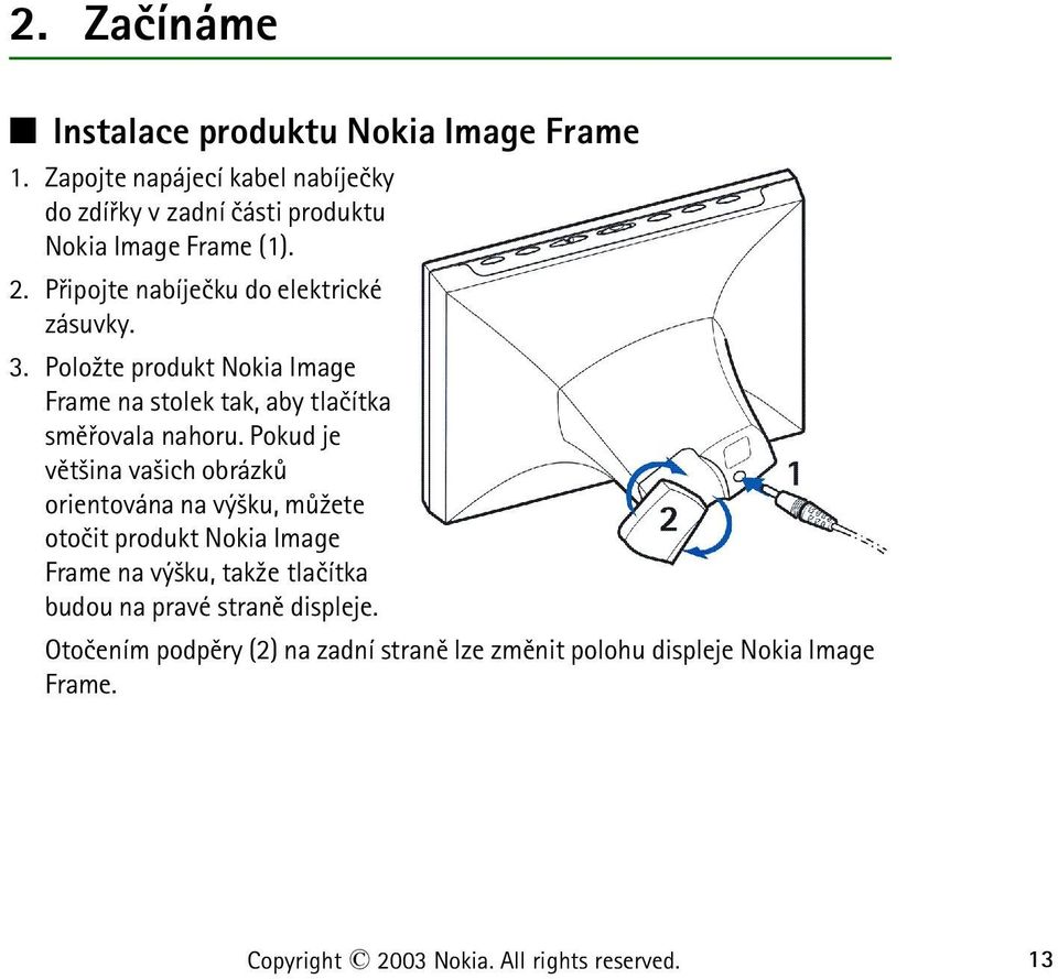 Polo¾te produkt Nokia Image Frame na stolek tak, aby tlaèítka smìøovala nahoru.