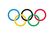 Olympijská vlajka Na bílém podkladě ve středu umístěný olympijský symbol pěti barevných kruhů přenáší i na vlajku symbolicky olympijské propojení kontinentů. Také vlajku schválil VI.