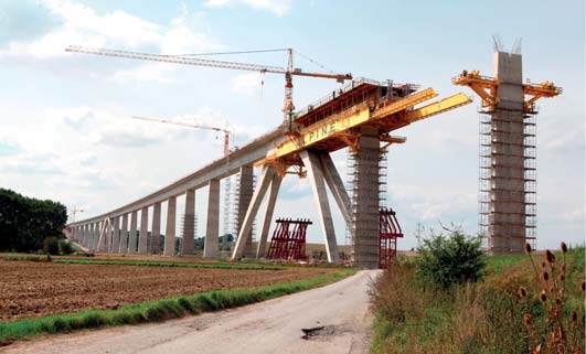 11 o pěti polích 2 x 24 + 6,5 + 2 x 24 m, délky 102,5 m.