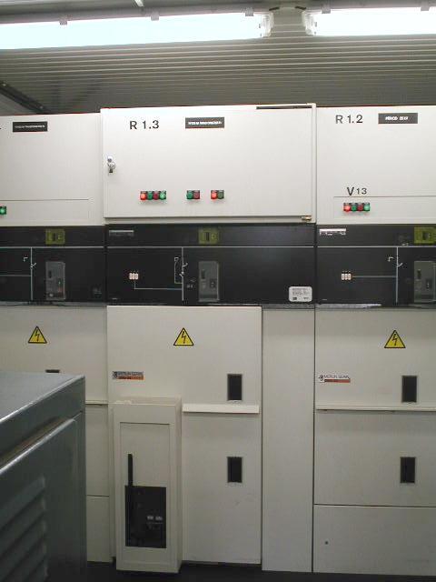 HV Switchboards up to 35 kv: Inside design: 2 line inlet SF6 insulated disconnector manual drive mechanical and light signalisation 1 outlet for transfromer T1 10 MVA disconnector + circuit breaker