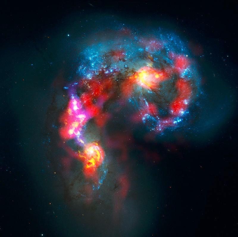 Zrážka dvoch galaxií Kompozitná snímka: HST viditeľná (modrá) ALMA infračervená oblasť (žltá,