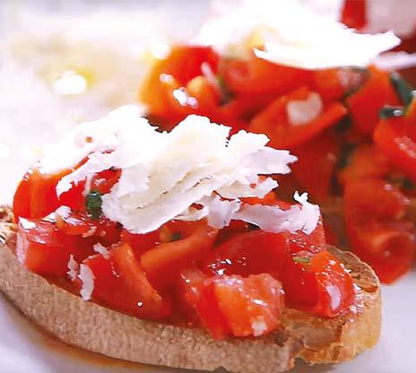 Bruschetta (Hrianka na taliansky spôsob) Ingrediencie na 2 porcie: 4 krajce chleba 3 stredne veľké paradajky 1 strúčik cesnaku pár lístkov
