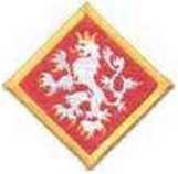 Lví skaut čtverec postavený na špičku, hrana 4 cm vyšívaný odznak, český lev na červeném podkladu, žlutý lem Lví skaut I.