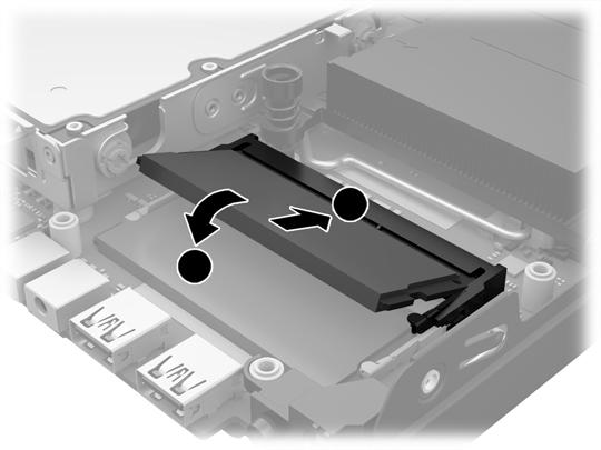 11. Zasuňte nový paměťový modul do zásuvky přibližně ve 30 úhlu (1) a poté ho zatlačte směrem dolů (2), aby jej západky zajistily na místě.