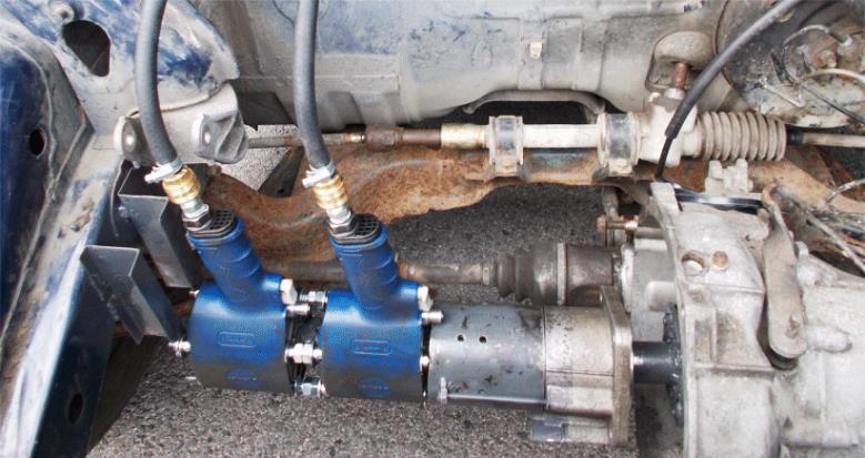 RVM 1 Gear of the vehicle RVM 2 Rotor of RVM Figure 5: On the left side: view on drive units (Rotary Vane Motors- RVM) placed in front of the original gearbox of prototype Felda-Air-9b.