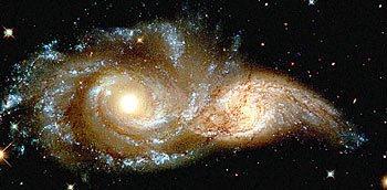9. Spirálové galaxie NGC 2207 a IC 2163 ze