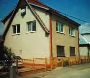 16. KRIVOSÚD - BODOVKA Pamätná tabuľa z červenkastého mramoru venovaná Jánovi Valkovi, pôvodne osadená na dome č.