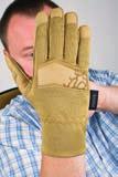 with an overlapping seam on the back side of the glove for a more sensitive manipulation with a gun, and a longer lifespan of the glove.