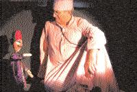 bellicose present. Using the interaction between puppets and performers, he creates a dreamlike world of his own.