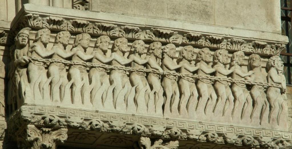 Zbytek vlysu vyplňuje řada odsouzených hříšníků, kteří se podobně jako spasení drží Obr. 70 Arles, kostel sv.