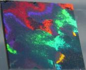 medium by slow and careful vessel tilting. After this treatment, layer showing clear diffraction colors (Fig. 2). Fig.