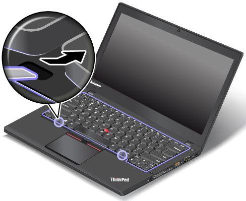 6. Chcete-li získat přístup ke šroubům pod rámem klávesnice, použijte plochý konec multifunkčního nástroje pro výměnu klávesnice a posuňte rám klávesnice směrem dopředu o 2,5 mm (0,1").