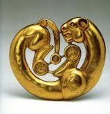 serpentine earring, disc-shaped mirrors, zoo- morphic sheet