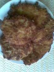 Potato cakes Ingredients: 1kg potatoes, 5 garlic cloves, salt, pepper, cumin, 2 eggs, 60 g flour, 60 g semolina, milk,, marjoram, oil fro frying If you like you can add smoked meats.