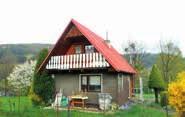500 m 2 v klidné části města, po rekonstrukci, krbová kamna s výměníkem, garáž.