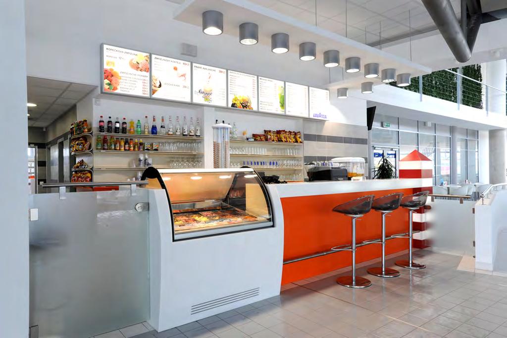 counter at the sauna with shelves made of white and orange polymer stone