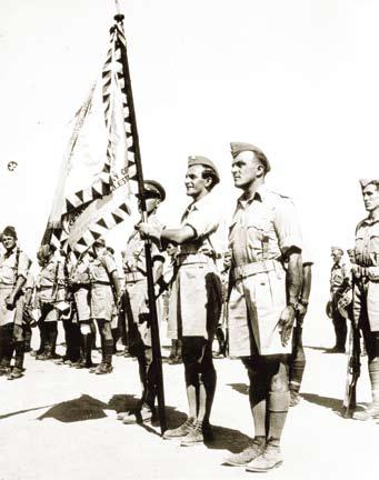 V červnu 1943 předal pluk obranu města Britům a na počátku července 1943 odplul do Velké Británie, kde