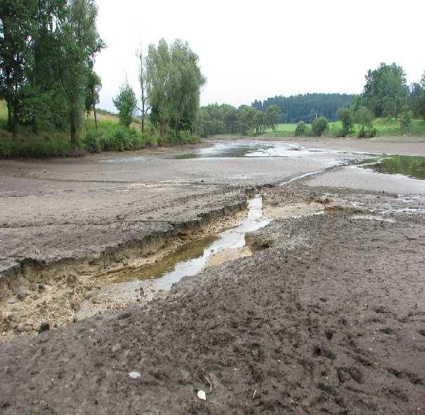 Obr. 6.12 Protržený Panenský rybník na Pertoltickém potoce nad obcí Pertoltice 7.